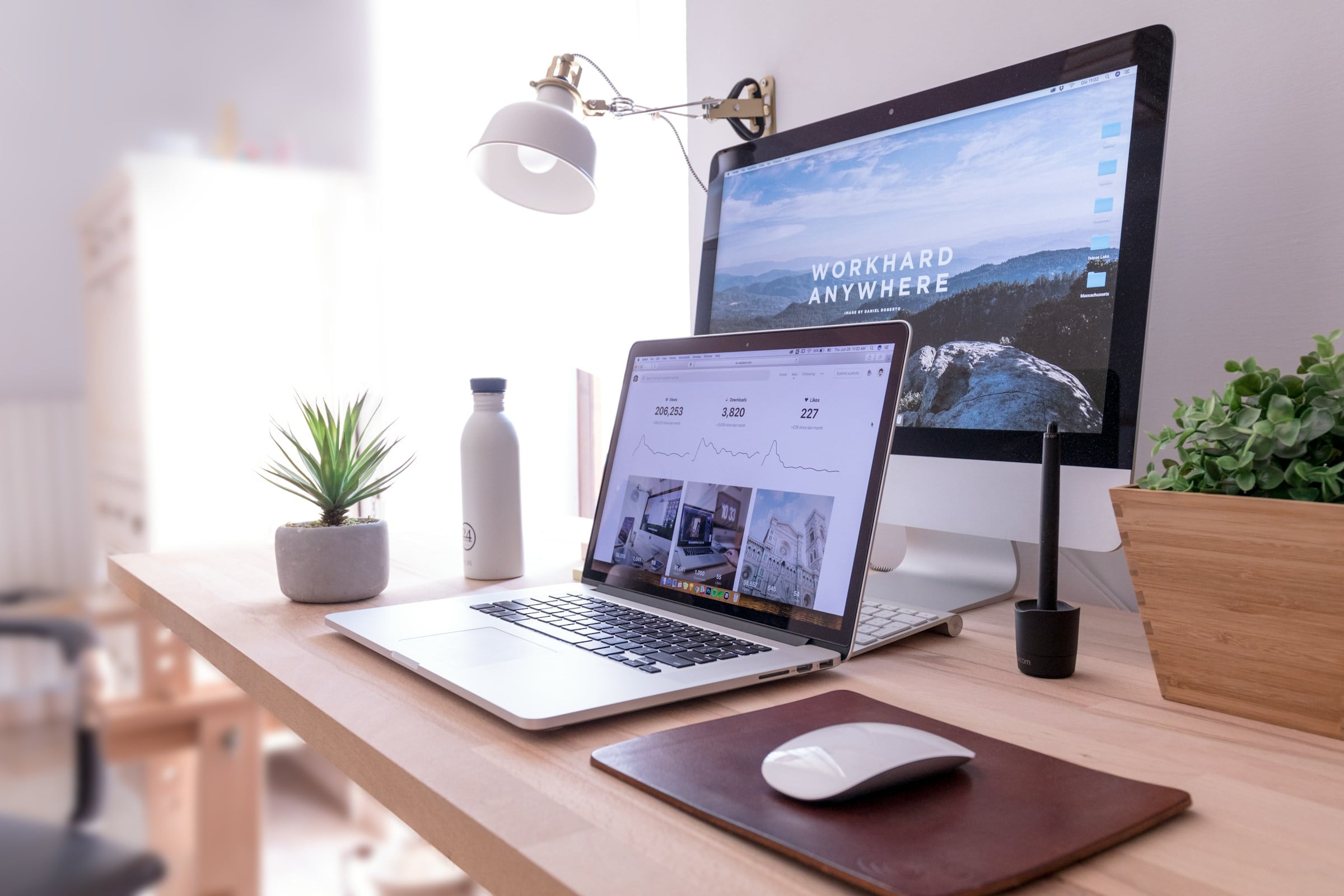 Bright desk with a laptop and monitor