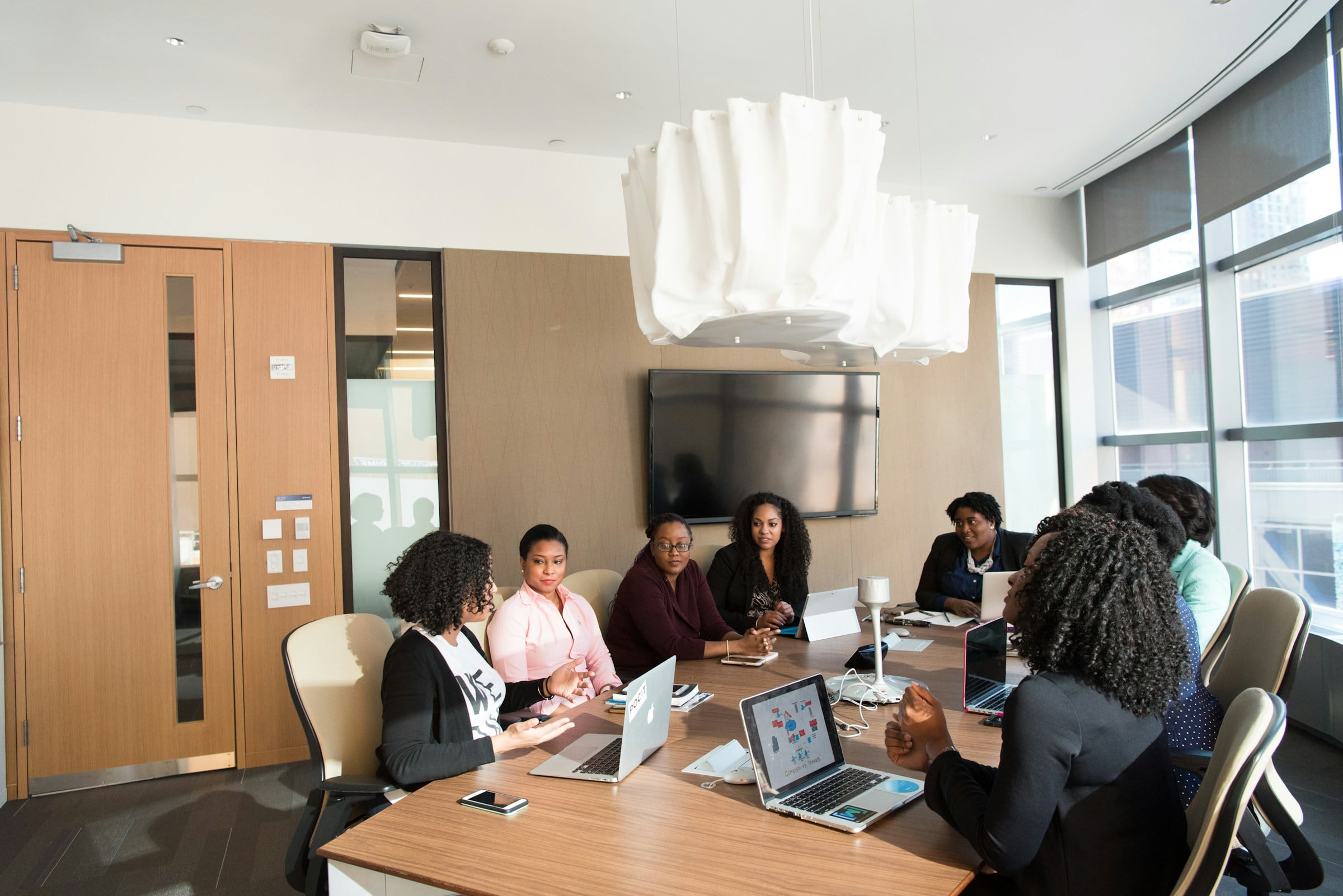 Team working together at a long table in an office