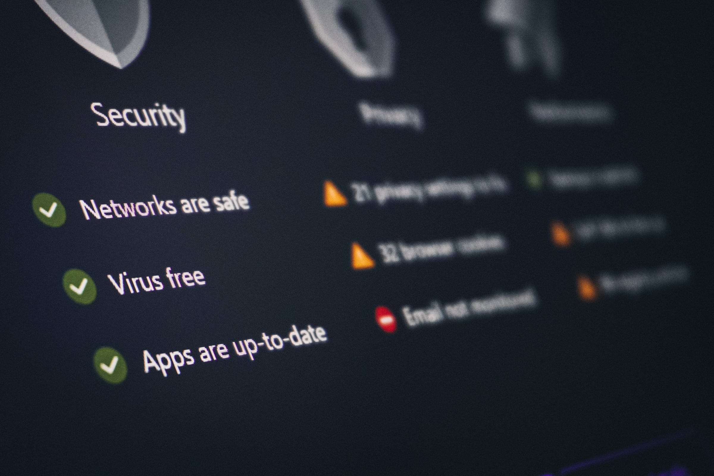 Person signing in on a laptop with a security check on screen