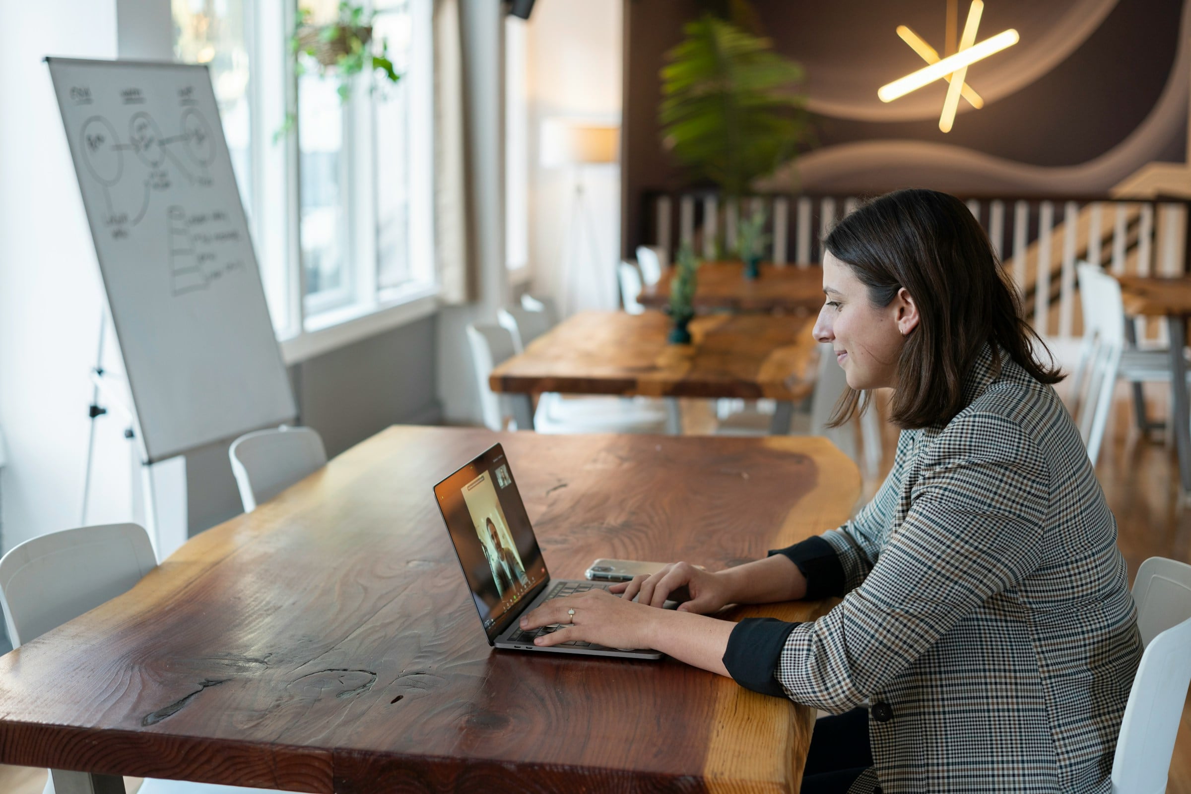 Professional attending an online training session on a laptop